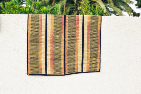 Carpet drying in the sunの写真素材