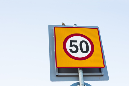 Road sign speed limit to 50, traffic sign.