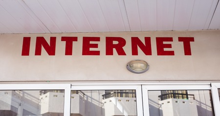 inscription internet, signboard outdoors. Internet cafe conceptの写真素材