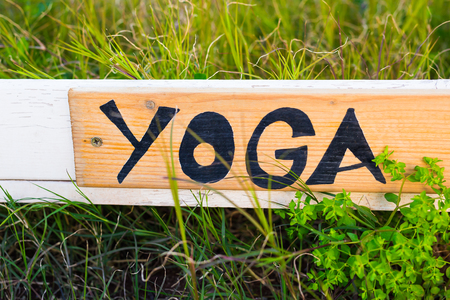 Sign with word yoga, signboard. Concept of yoga and meditationの写真素材