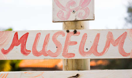 Signboard of Museum. Museum direction sign in green areaの写真素材