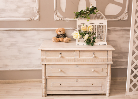 Classic interior of baby room with chest of drawers and teddy bearの写真素材