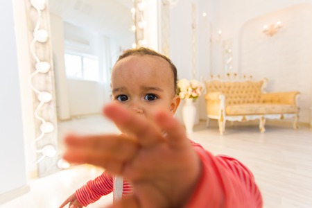 Cute baby making a funny surprised faceの写真素材