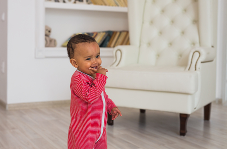 Portrait of smiling mixed race baby at homeの写真素材