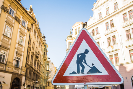 Digging sign. Works ahead warning sign on a road.の写真素材