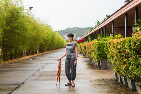 Portrait of happy beautiful woman posing on the street in summer, friendly smiling, looking at camera with cheerful confident expressionの写真素材