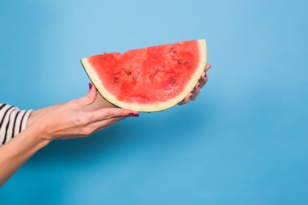 Summer, vacation, diet and vegans concept - Close up of woman holding watermelonの写真素材