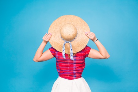 Beautiful woman in hat, back viewの写真素材