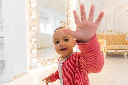 Cute curious baby in the roomの写真素材