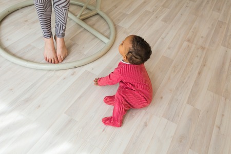 Cute curious baby in the roomの写真素材