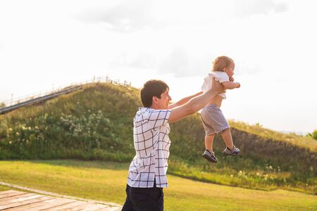 Happy father and son portrait playing together having funの写真素材
