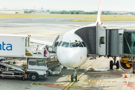 PRAGUE, CZECH REPUBLIC - JUNE 16, 2017: Vaclav Havel Prague International Airport, Ruzyne, Czech Republic. Loading luggage in the airplaneのeditorial素材