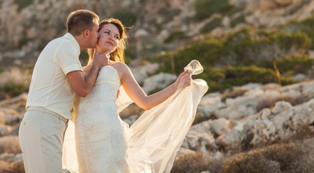 Portrait of happy bride and groom outdoor in nature location. Summer or autumn season.の写真素材
