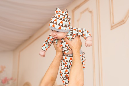 man holding a baby son