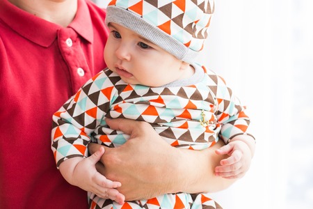 Father holding a baby son