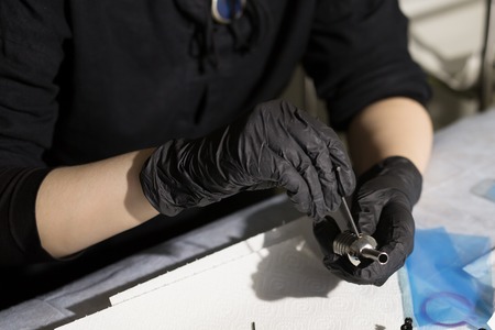 master tattoo artist prepares tools for tattooing.の写真素材