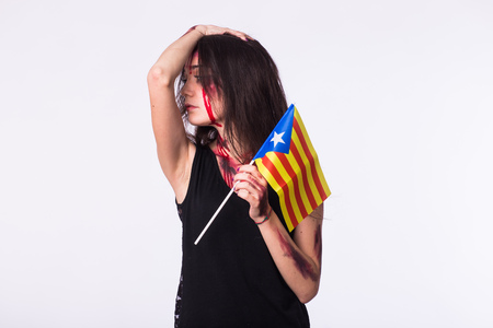 The victim woman holds the flag of Catalonia. Protest against terrorism.の写真素材