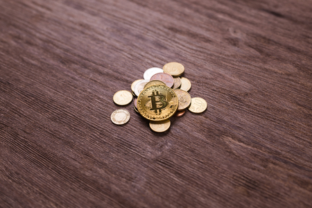 Bitcoin on coins of different countries . Digital payment system. Digital coin crypto money on bitcoin farm in digital cyberspaceの写真素材