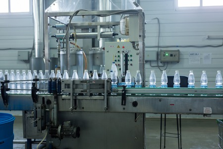 Closeup on mineral water bottles in raw and linesの写真素材