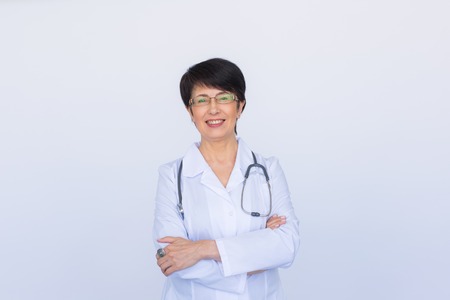 Portrait of doctor woman with stethoscope over white background