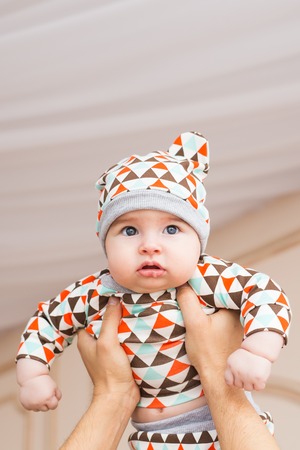 Adorable baby boy in sunny bedroom. Newborn child relaxingの写真素材