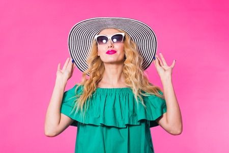 Fashion studio portrait of glamour girl, stylish clothes sunglasses on pink background with...