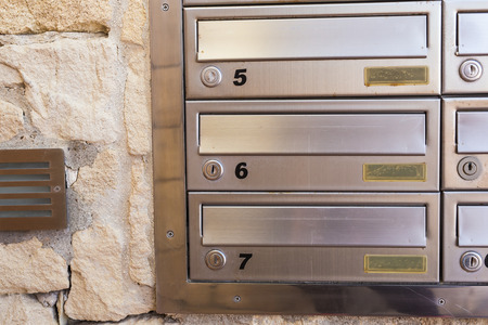 Postman every morning delivers letters to these boxes