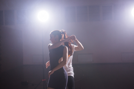 Young couple dancing latin dance Bachata, merengue, salsa. Two elegance pose in dance classの写真素材