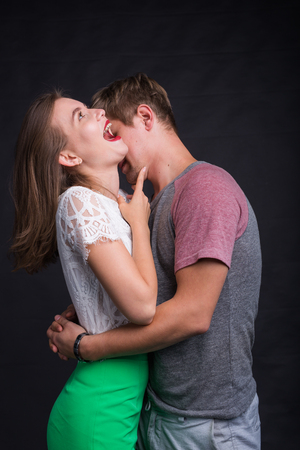 Passionate young people in love on black backgroundの写真素材