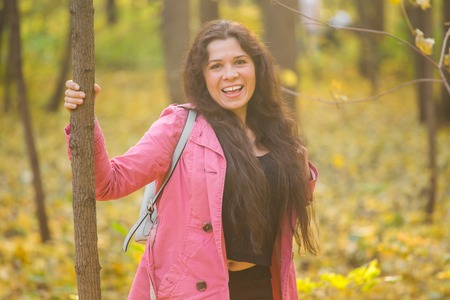 Autumn, nature and people concept - Portrait of beautiful plus size woman in park