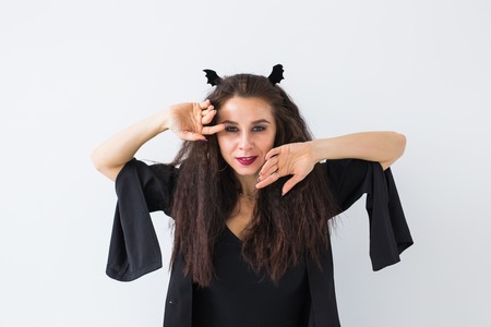 Halloween and holidays concept - Witch woman posing