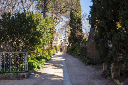 SAINT-REMY-DE-PROVENCE , FRANCE - February 12, 2018. Saint-Paul-de-Mausole, St-Remy-de-Provence. Alley leading to the monastery.のeditorial素材