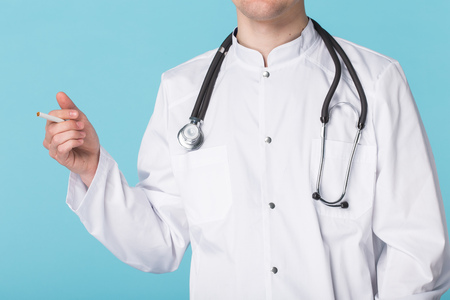 Addiction, bad habits and stress concept - Close up of male doctの写真素材