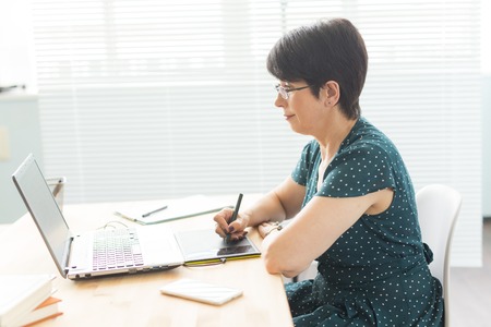 Office, graphic designer concept - Business woman hands holding digital tablet, drawing the sketchの写真素材