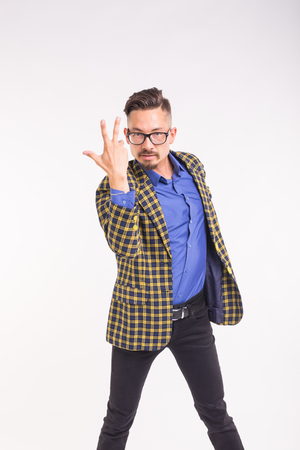 People, fashion and expression concept - portrait of a young funny stylish hipster bearded man on a white backgroundの写真素材