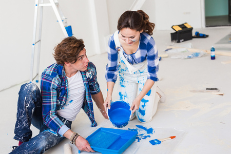 Repair, renovation and people concept - Close up portrait of couple pour paintの写真素材