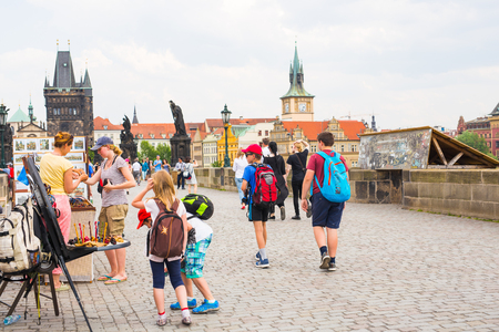 PRAGUE, CZECH REPUBLIC - MAY 30, 2017: Tourists walk along the Charles Bridge on a sunny day in Pragueのeditorial素材