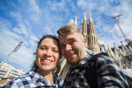 Travel, holidays and people concept - Happy couple taking selfie photo in Barcelonaの写真素材