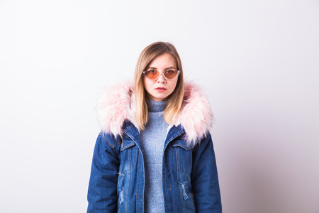 People, urban style and fashion concept - Stylish hipster girl wearing jeans coat on white backgroundの写真素材