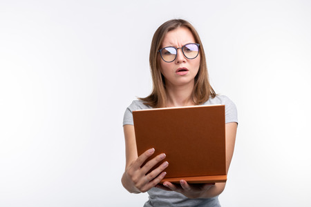 Study, education, people concept - female student is tired of learning classes, she is in gray...