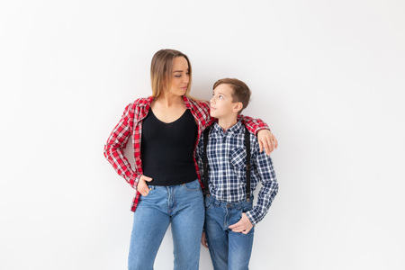 Mothers day, children and family concept - Beautiful woman and her son on white backgroundの写真素材