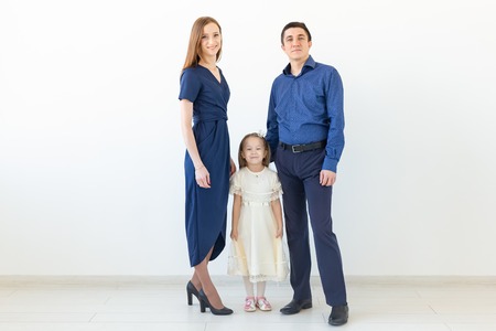 people, family and happiness concept - happy family with child on white backgroundの写真素材
