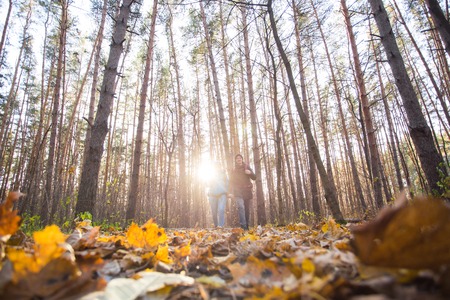 Adventures, tourism and nature concept - Low-angle shot of walking hike couple in a distanceの写真素材