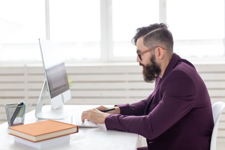 Illustrator, designer and technology concept - Side view handsome man with beard working on at the...