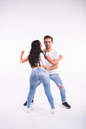 Salsa, kizomba and bachata dancers on white background. Social dance conceptの写真素材