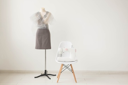 Dressmaker, fashion designer and tailor concept - Photo of the working environment seamstress on white background with copy spaceの写真素材