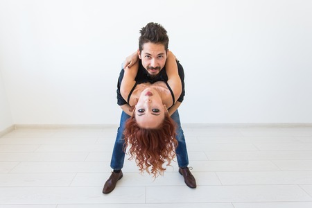 Romantic, passion, people concept - funny young couple dancing with passionの写真素材