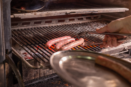 food, delicious and meat dishes concept - Horse sausages prepared on barbequeの写真素材