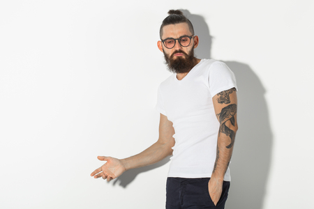 hipster, people concept - Tattooed bearded man in white shirt isolated on white backgroundの写真素材