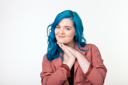 People and fashion concept - Woman with blue hair dressed jacket over white backgroundの写真素材